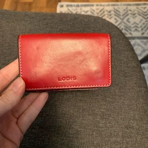 Lodi’s red credit card holder.